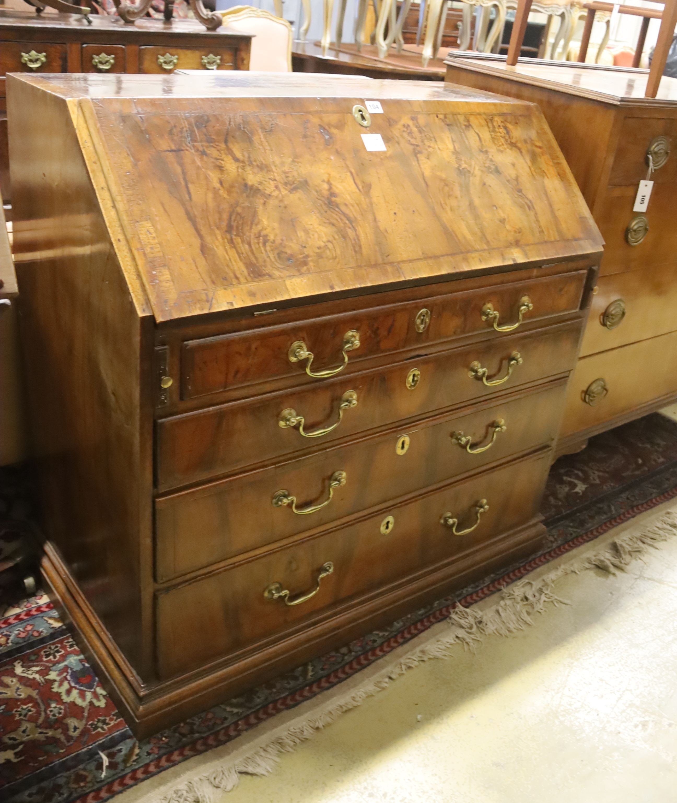 A George II figured walnut bureau, width 99cm, depth 53cm, height 98cm